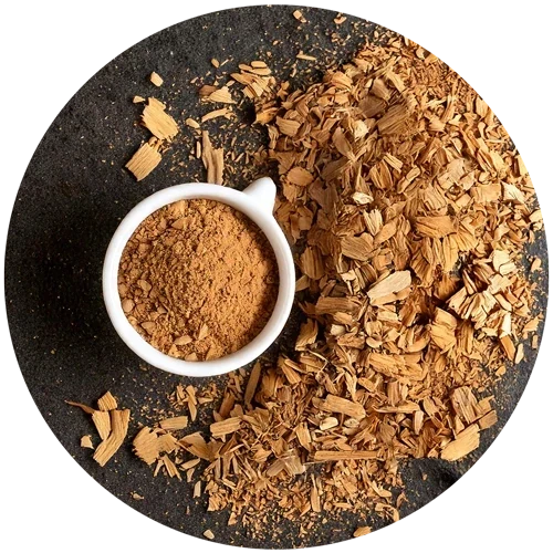 Muira puama bark powder, amber-brown, in a dish